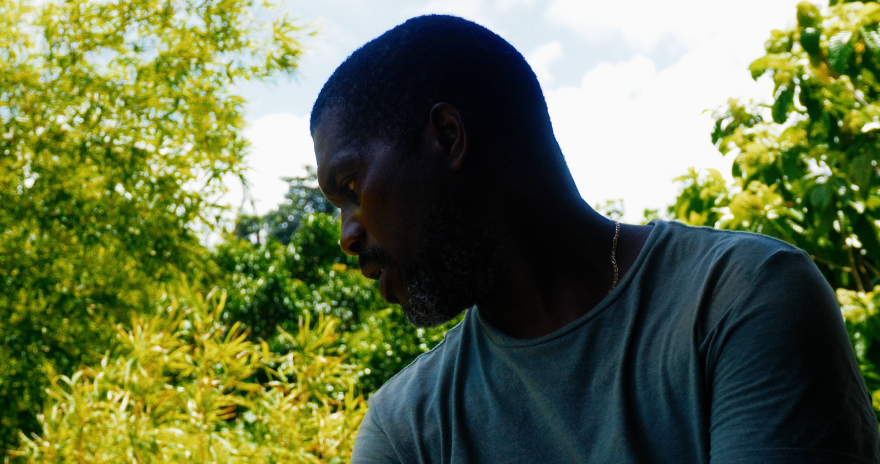 Your host, Dad, photographed outdoors among the farm’s tropical planting