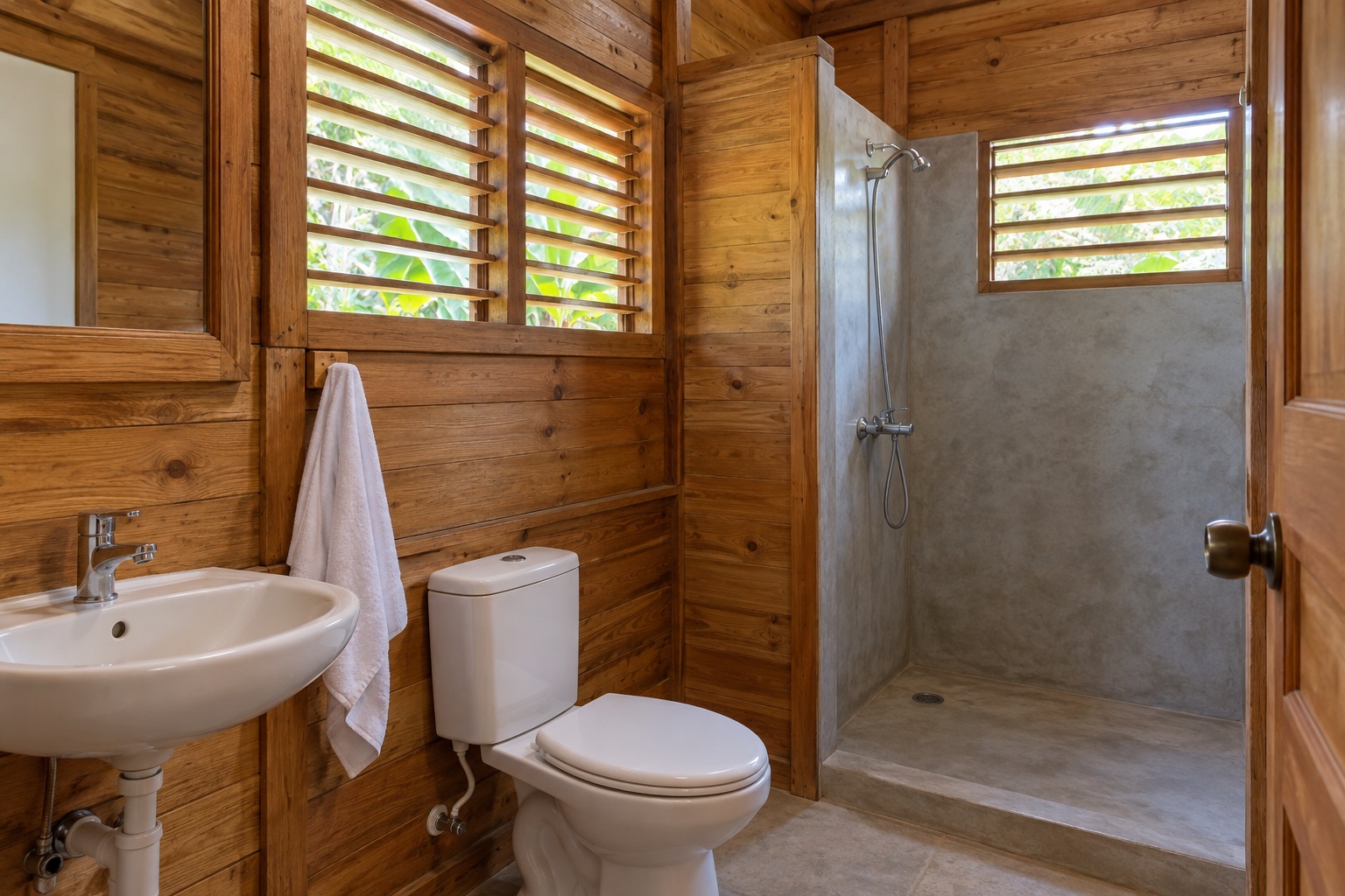 A simple bathroom with timber details and basic fixtures